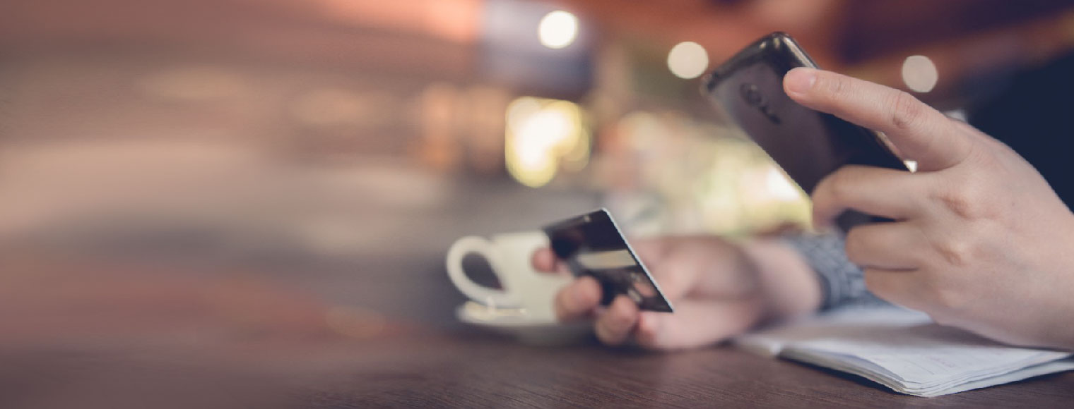 Person making an online transaction with phone Person making an online transaction with phone