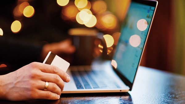 Laptop being used to make an online purchase Laptop being used to make an online purchase