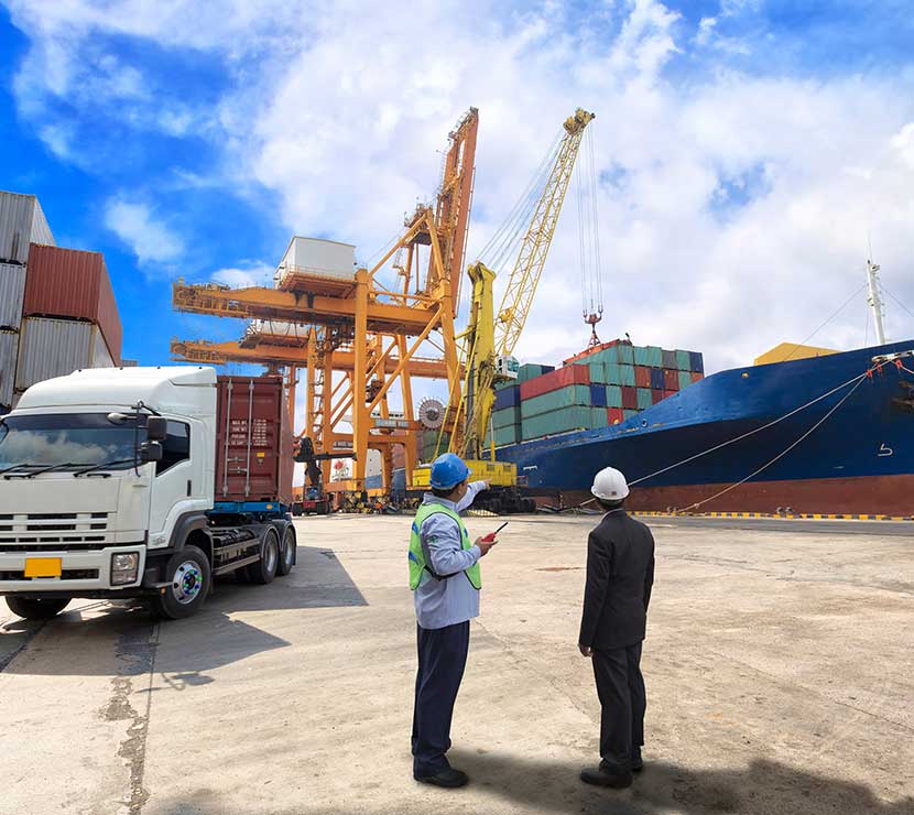 Engineer and executive discussing in a harbour port Engineer and executive discussing in a harbour port